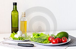 Raw healthy food. Vegetables, mozzarella and olive oil on white background, top view