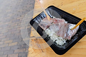 Raw herring fish and raw onion