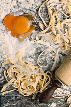 Raw homemade pasta with with egg yolk as heart