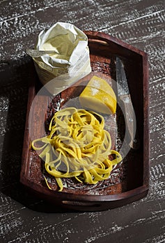 Raw homemade pasta on a vintage tray