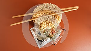 Raw instant noodles with chopsticks and spices. Copy space asian food. pasta, for the preparation of which it is enough to pour