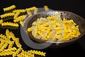 Raw italian torti pasta on black glass