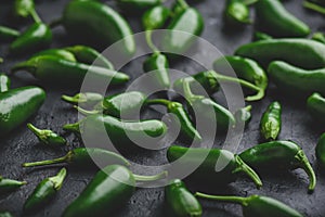 Raw Jalapeno Peppers on Concrete Backdrop