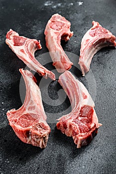 Raw lamb chops, Rack of Lamb. Black background. Top view