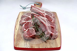 Raw lamb cutlets with rosemary