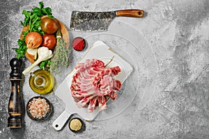 Raw lamb ribs with ingredients for cooking