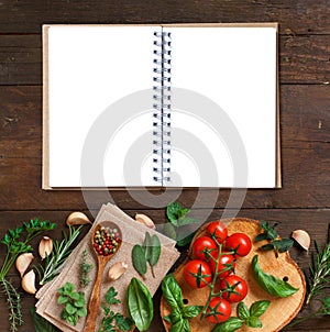 Raw lasagna pasta, vegetables and herbs with notebook