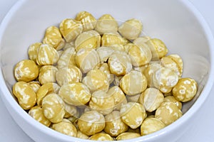 Raw Macadamia Nuts in a Bowl