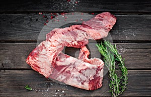 Raw machete beef steak with seasonings photo