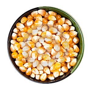 Raw maize corns in round bowl isolated on white