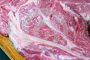 Raw marbled beef steak. Close-up photo on dark background