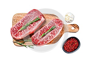 Raw marbled beef steak, top blade meat steak. Isolated on white background. Top view.