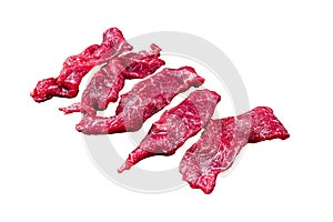 Raw marbled meat cut into thin strips for beefstroganoff. Isolated on white background, Top view.