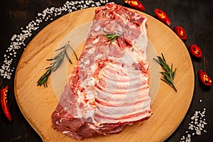 Raw marinated ribs. black background, view from above, close-up