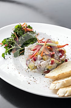 Raw marinated sea bass fish ceviche salad modern gourmet fusion cuisine starter set in melbourne australia restaurant