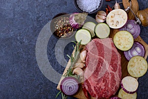 Raw meat from black angus and vegetables