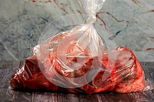 Raw meat and bone packed in plastic bag.Selective focus. Beef bone selection for soup