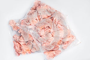 Raw meat box for supermarket, retail.Raw chicken backs in a package packed in a box for delivery on a white isolated background