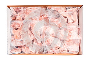 Raw meat box for supermarket, retail.Raw chicken backs in a package packed in a box for delivery on a white isolated background,