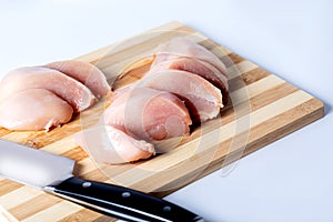 Raw meat chicken breast cut into pieces.