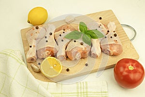 Raw meat, chicken legs, with olive oil, herbs and spices