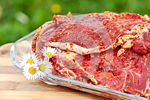 Raw meat with daisys ready to grilling