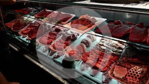 Raw meat on display at butcher shop in Rome, Italy