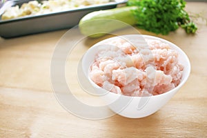 Raw meat. Fresh chicken minced ground-meat in a round white plat photo