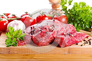 Raw meat with herbs and vegetables