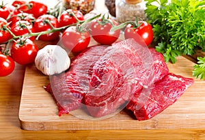Raw meat with herbs and vegetables