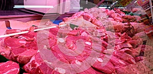 Raw meat laid side by side in a supermarket