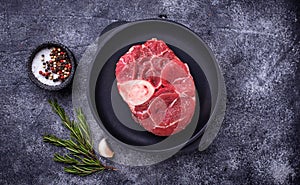 Raw meat osso buco with spices photo