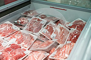 Raw meat in plastic box in supermarket