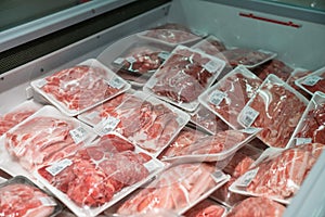 Raw meat in plastic box in supermarket