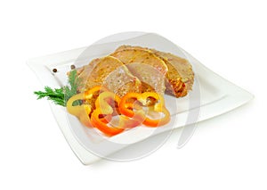 Raw meat. Pork escalope slices with sause in a Dish Isolated Against White Background