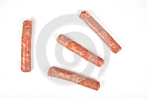 Raw meat sausages isolated on white background