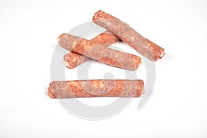 Raw meat sausages isolated on white background