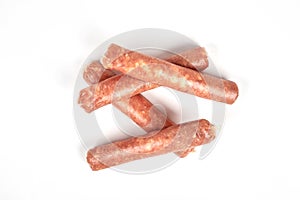 Raw meat sausages isolated on white background