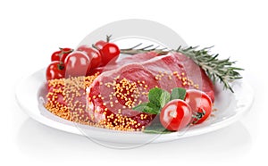 Raw meat with spice on plate