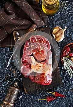 raw meat with spice and salt on board