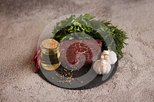 Raw meat with spices and herbs