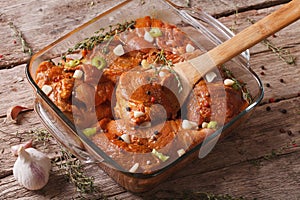 Raw meat in a spicy red marinade in a bowl close up. horizontal