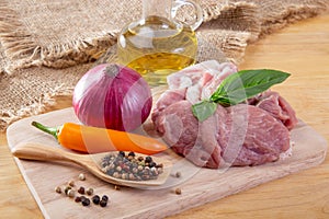 Raw meat, vegetables and olive oil