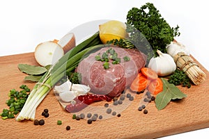 Raw meat, vegetables and spices isolated.