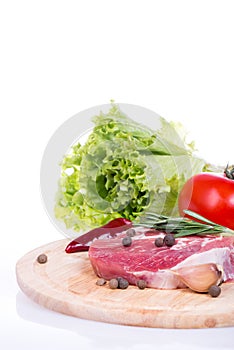 Raw meat, vegetables and spices isolated