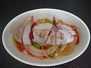 raw meat on white plate with vegetables
