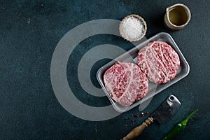 Raw minced meat and ingredients for home made grill burgers. Semifinished food. American cuisine. Raw burger