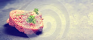 Raw minced meat on wooden table