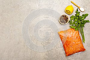 Raw minced red fish stuffing on a stone background. Ingredient for making fish-balls, casseroles, terrine, pate. Spices, salt,