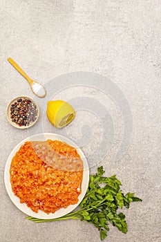 Raw minced red fish stuffing on a stone background. Ingredient for making fish-balls, casseroles, terrine, pate. Spices, salt,